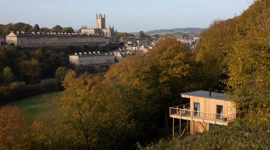 Georgian terraces and the Abbey tower sit in a green bowl of hills, so a lodge on the edge feels miles away